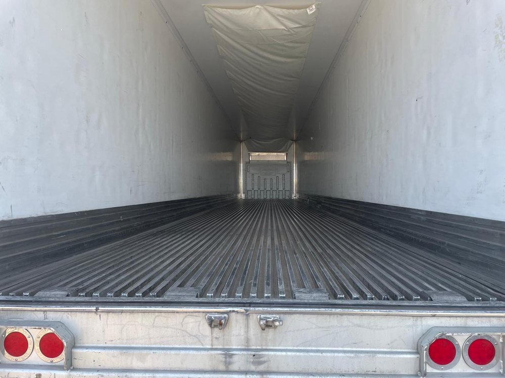 Interior of a reefer trailer showing duct floor and walls