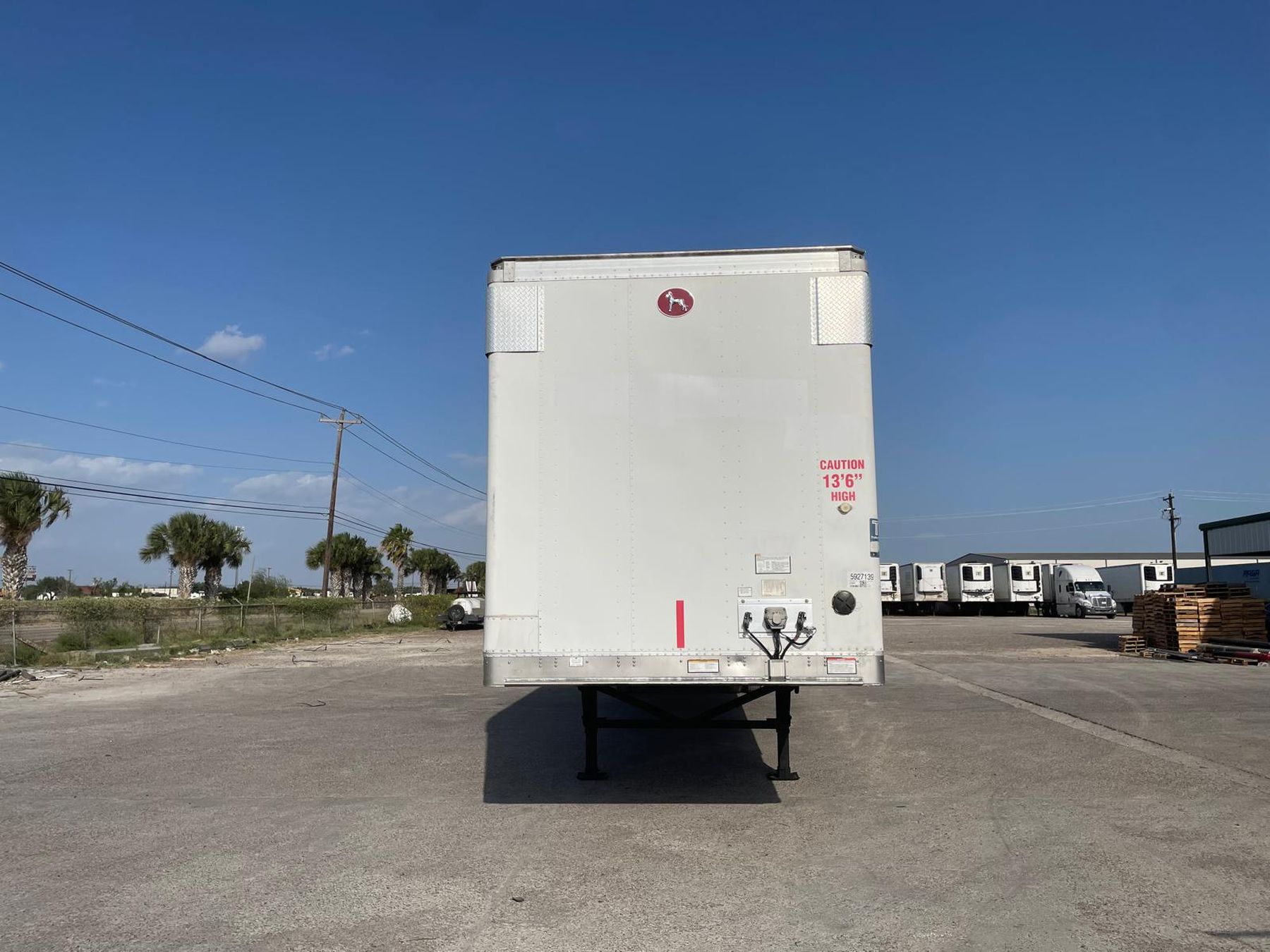 Reefer trailer with a row of trailers behind it